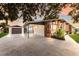 Stylish home exterior with a porte-cochere and modern design details at 4232 Pandora Rd, Venice, FL 34293