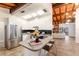 Modern kitchen with an island, stainless steel appliances, and an open floor plan at 4232 Pandora Rd, Venice, FL 34293