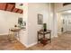 Open-concept kitchen with a breakfast bar, stylish tile flooring, and a convenient bar cart at 4232 Pandora Rd, Venice, FL 34293