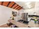 Stylish kitchen featuring granite countertops, stainless steel appliances, and a modern island with a sink at 4232 Pandora Rd, Venice, FL 34293