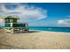 Brightly painted lifeguard station on sandy beach offering clear ocean views at 4232 Pandora Rd, Venice, FL 34293