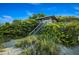 Charming lifeguard stand nestled among lush vegetation with direct beach access at 4232 Pandora Rd, Venice, FL 34293