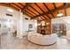 Spacious living room featuring a brick fireplace, high ceilings, and tile floors at 4232 Pandora Rd, Venice, FL 34293