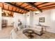 Spacious living room with a sectional sofa and wood-beam ceilings at 4232 Pandora Rd, Venice, FL 34293