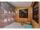 Unique sunroom featuring brick and wood paneling, complemented by natural light at 4232 Pandora Rd, Venice, FL 34293