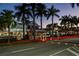 Vibrant town center featuring shops, restaurants, and palm trees along the street at 4232 Pandora Rd, Venice, FL 34293