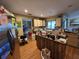 View of the kitchen with stainless steel appliances, an island, and wood floors at 4343 Arrow Ave, Sarasota, FL 34232