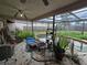 Back patio with pool view and lots of foliage at 4343 Arrow Ave, Sarasota, FL 34232