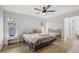 Bedroom featuring a ceiling fan, natural light, and wood-look flooring at 4344 Bent Tree Blvd, Sarasota, FL 34241