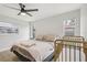 Bedroom showcasing windows, ceiling fan and wood-look flooring at 4344 Bent Tree Blvd, Sarasota, FL 34241