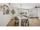 Airy dining room featuring an elegant chandelier and modern furniture at 4344 Bent Tree Blvd, Sarasota, FL 34241