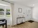 Inviting entryway featuring a stylish console table and a bay window at 4344 Bent Tree Blvd, Sarasota, FL 34241