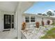 Elegant front entryway with decorative plants and a view of the bay window at 4344 Bent Tree Blvd, Sarasota, FL 34241