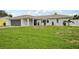 Well-maintained single-story home with a lush lawn and an attached garage at 4344 Bent Tree Blvd, Sarasota, FL 34241