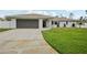 Beautiful single-story home with a well-maintained lawn and gray garage door at 4344 Bent Tree Blvd, Sarasota, FL 34241