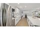 Open kitchen with stainless appliances, a large island, and modern design at 4344 Bent Tree Blvd, Sarasota, FL 34241