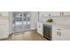 Kitchen area features a wine cooler and access to the outdoor pool area at 4344 Bent Tree Blvd, Sarasota, FL 34241