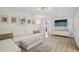 Bright living room with a comfortable white sofa, plush rug, and stylish decor at 4344 Bent Tree Blvd, Sarasota, FL 34241