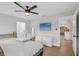 Bedroom features a TV, a vanity and modern design at 4344 Bent Tree Blvd, Sarasota, FL 34241