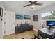 A functional home office boasts natural light and a stylish desk with comfortable chair at 4344 Bent Tree Blvd, Sarasota, FL 34241