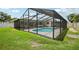 Inviting screened-in pool offers refreshing relaxation and outdoor living space at 4344 Bent Tree Blvd, Sarasota, FL 34241