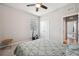 Bedroom featuring carpet, closet, ceiling fan, and a window with shade at 4405 Weathered Moss Gln, Palmetto, FL 34221