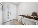 Bright foyer featuring a console table, neutral walls, and a tiled floor at 4405 Weathered Moss Gln, Palmetto, FL 34221