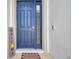 Welcoming front door featuring a sidelight window, modern hardware, and a charming welcome mat at 4405 Weathered Moss Gln, Palmetto, FL 34221