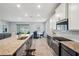 Gourmet kitchen showcasing granite countertops, stainless steel appliances, and a dining area at 4405 Weathered Moss Gln, Palmetto, FL 34221