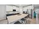 Kitchen includes an island with a sink, granite countertops, and bar stool seating at 4405 Weathered Moss Gln, Palmetto, FL 34221