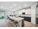 Open kitchen concept includes a kitchen island with bar stool seating and dining area at 4405 Weathered Moss Gln, Palmetto, FL 34221