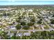 An elevated shot shows the beautiful surrounding neighborhood with a glimpse of the city in the distance at 4455 Emerald Ridge Dr, Sarasota, FL 34233