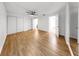 Bright bedroom featuring wood floors, a ceiling fan, and neutral wall color scheme with ample closet space at 4455 Emerald Ridge Dr, Sarasota, FL 34233