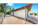 Side view shows a fenced yard and modern exterior with a gated entrance at 4455 Emerald Ridge Dr, Sarasota, FL 34233