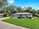 Charming single-story home with a well-manicured lawn and inviting curb appeal at 4455 Emerald Ridge Dr, Sarasota, FL 34233