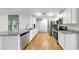 Bright kitchen with stainless steel appliances, granite countertops, and modern fixtures at 4455 Emerald Ridge Dr, Sarasota, FL 34233