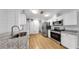Modern kitchen with stainless steel appliances, granite countertops, and ample storage at 4455 Emerald Ridge Dr, Sarasota, FL 34233