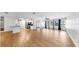 Spacious living room boasts an open-concept design with the kitchen visible with natural light from multiple windows at 4455 Emerald Ridge Dr, Sarasota, FL 34233
