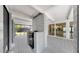 Enclosed patio featuring a built-in grill and glimpses into the home's interior at 4455 Emerald Ridge Dr, Sarasota, FL 34233
