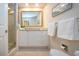 Elegant bathroom with a large mirror, granite countertop, and glass-enclosed shower at 483 Partridge Cir, Sarasota, FL 34236