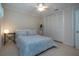 Cozy bedroom featuring neutral tones, tile flooring, and ample closet space at 483 Partridge Cir, Sarasota, FL 34236