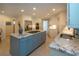 Bright kitchen with granite countertops, stainless steel appliances, and a center island with a gas cooktop at 483 Partridge Cir, Sarasota, FL 34236