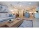 Inviting living room with tile floors, ceiling fan, and open access to the kitchen at 483 Partridge Cir, Sarasota, FL 34236