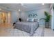 Serene main bedroom featuring cool blue walls, tile floor, and decor at 483 Partridge Cir, Sarasota, FL 34236