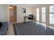 Home office with plantation shutters and large rug at 483 Partridge Cir, Sarasota, FL 34236