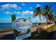 Scenic Bird Key Park sign with palm trees, blue sky, and waterfront views, inviting visitors to a relaxing outdoor experience at 483 Partridge Cir, Sarasota, FL 34236