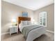Cozy bedroom features a comfortable bed, bedside tables, and a shuttered window, creating a relaxing space at 5121 Serata Dr, Lakewood Ranch, FL 34211
