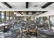 Spacious dining room features many tables and chairs, decorative lighting, and large windows offering abundant natural light at 5121 Serata Dr, Lakewood Ranch, FL 34211