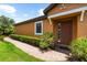 Home exterior showcasing brick walkway and well-maintained landscaping at 5121 Serata Dr, Lakewood Ranch, FL 34211