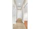 Hallway featuring neutral paint, white doors, neutral tile floors, and recessed lighting at 5121 Serata Dr, Lakewood Ranch, FL 34211